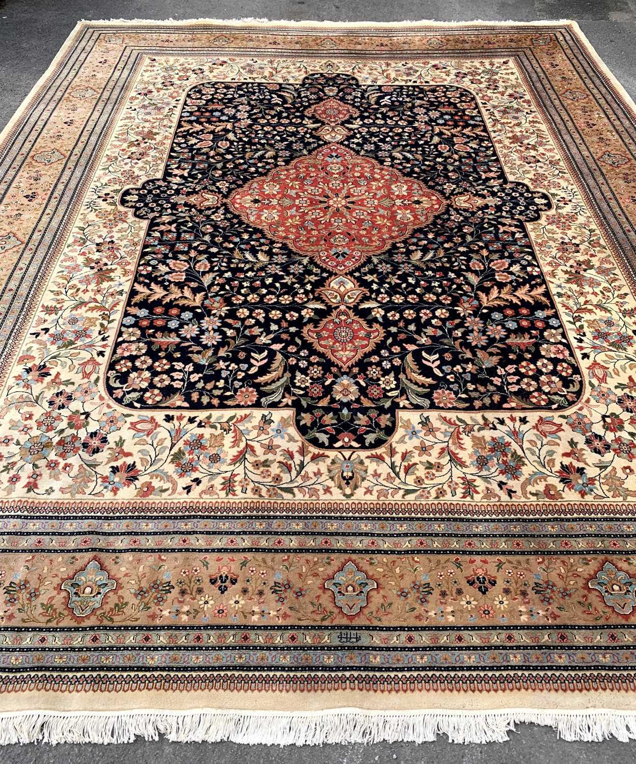 MODERN ORIENTAL CARPET, red central medallion with mosque lamps, on a dark field with floral ivory