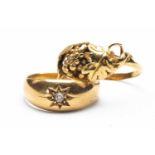 TWO 18CT GOLD RINGS comprising leaf and berry design ring, together with diamond 'gypsy' set ring,