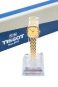 9CT GOLD TISSOT LADY'S 'SAPHIR' WRISTWATCH, the champagne dial with baton hour markers, having