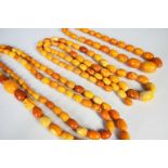 FOUR AMBER NECKLACES, various sizes Comments: one necklace broken Condition Report:The total