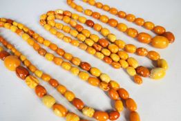 FOUR AMBER NECKLACES, various sizes Comments: one necklace broken Condition Report:The total