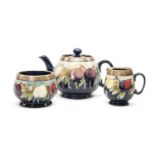 MOORCROFT SILVER MOUNTED 'WISTERIA' PATTERN TEASET, comprising teapot, milk jug and sugar basin,