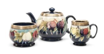 MOORCROFT SILVER MOUNTED 'WISTERIA' PATTERN TEASET, comprising teapot, milk jug and sugar basin,