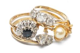 THREE 9CT GOLD DRESS RINGS three set with cubic zirconia, and a 14K gold cultured pearl ring, 11.