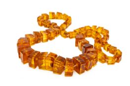 FACETED BALTIC AMBER NECKLACE, comprising 60 graduated square-cut beads with natural inclusions,