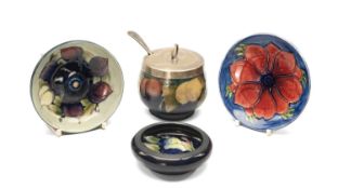 FOUR ITEMS MOORCROFT POTTERY, comprising 'Wisteria' pattern preserve jar and plated cover, '