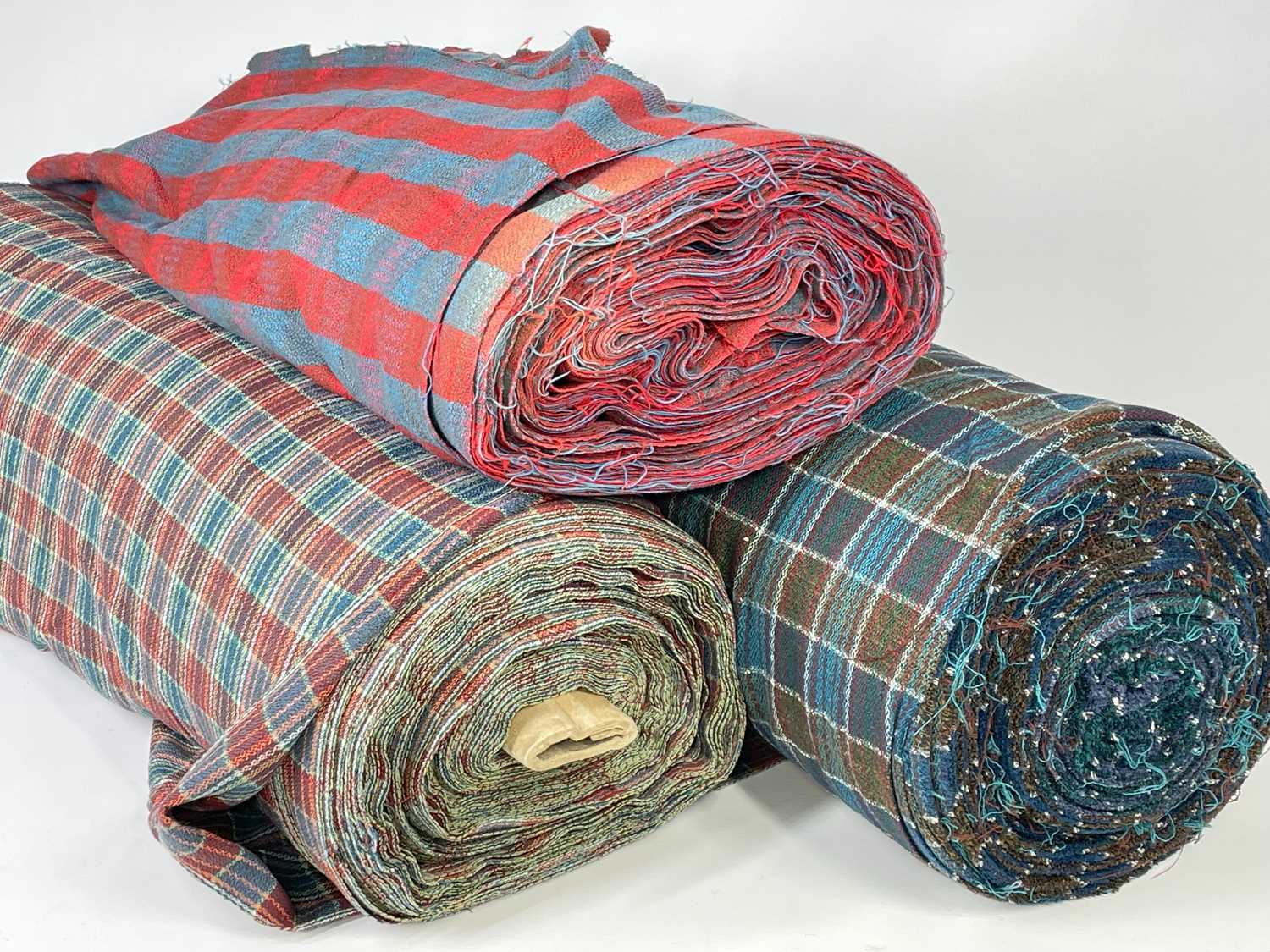 THREE BOLTS OF CHECK / PLAID WOOL FABRIC (3) Provenance: private collection Swansea Comments: good