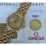 18CT GOLD OMEGA LADY'S WRISTWATCH, having diamond set dial and bezel, integrated 18ct gold brick