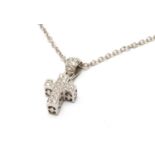 18K WHITE GOLD CROSS PENDANT, set with diamond chips on 18K white gold chain, 8.0gms Provenance: