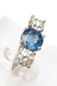 PLATINUM THREE STONE DIAMOND & SAPPHIRE RING, claw set, the central circular sapphire (8mm