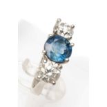 PLATINUM THREE STONE DIAMOND & SAPPHIRE RING, claw set, the central circular sapphire (8mm