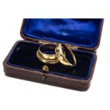 THREE GOLD RINGS, comprising two 18ct rings, one set with small diamond, 9.2gms gross and a 9ct