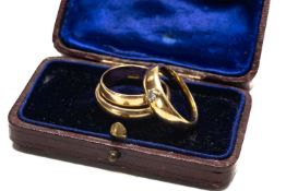 THREE GOLD RINGS, comprising two 18ct rings, one set with small diamond, 9.2gms gross and a 9ct