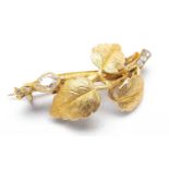 YELLOW METAL LEAF BAR BROOCH, set with old cut pear diamond and rose cut diamond chips, unmarked,