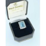 18CT GOLD AQUAMARINE & DIAMOND CLUSTER RING, claw set, the central rectangular stone (12 x 8.5mms