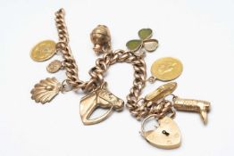 9CT GOLD CURB LINK BRACELET, with heart shaped padlock, with various 9ct gold attachments