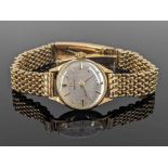 9CT GOLD LADY'S OMEGA WRISTWATCH, the silvered dial with baton markers, movement numbered