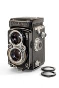 A ROLLEIFLEX 2.8F MEDIUM FORMAT CAMERA - black, serial no. 1144403, with a Zeiss-Opton, Tessar f/2.8