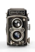 A ROLLEIFLEX 3.5F MEDIUM FORMAT CAMERA - black, serial no. 1060866, with Carl Zeiss Jena, Tessar f/