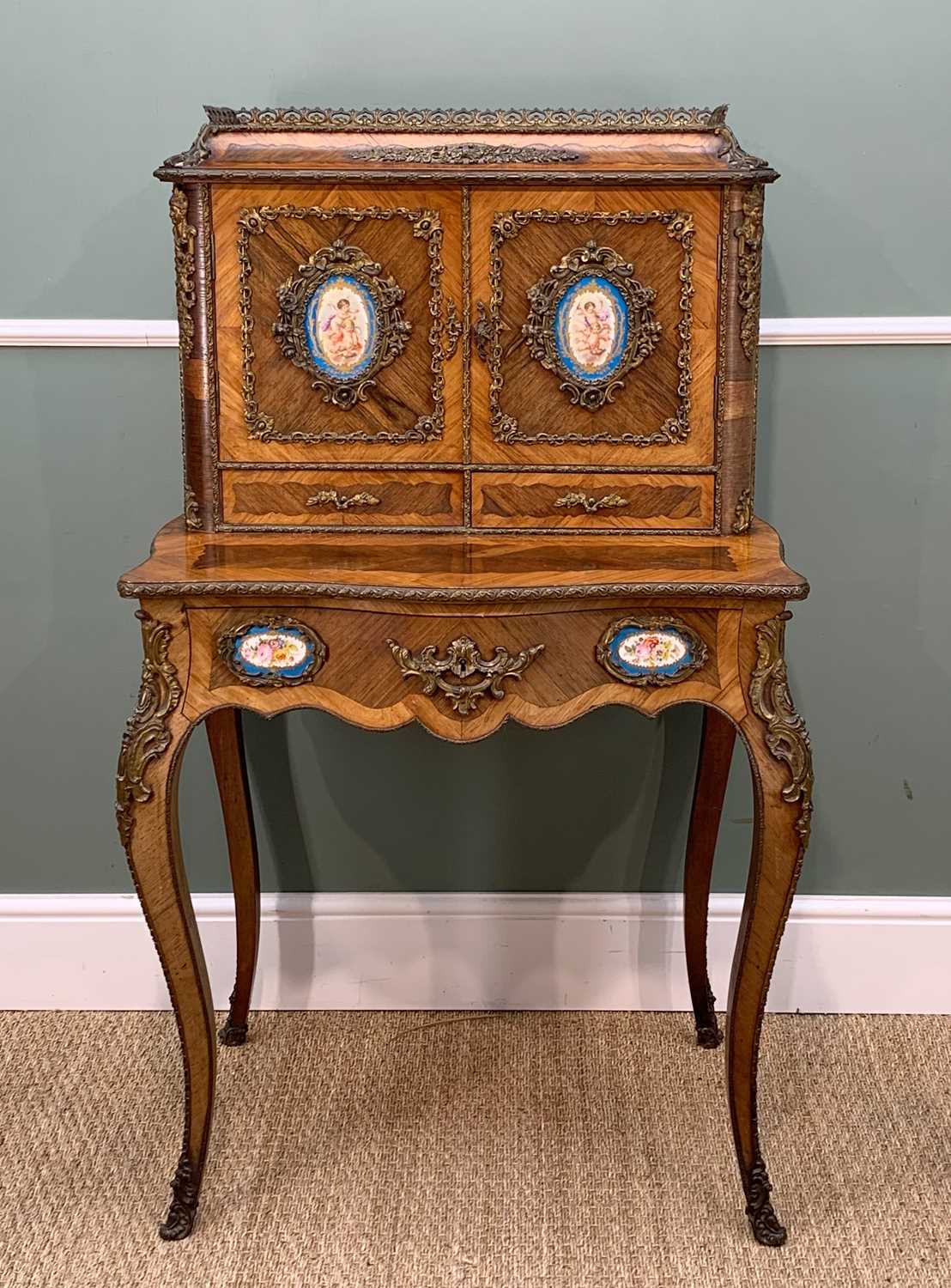 GOOD PORCELAIN & GILT BRONZE MOUNTED BONHEUR DU JOUR, 19th Century, in kingwood and rosewood with