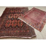 ORIENTAL RUG, probably Afghan, navy blue and burnt orange styled floral field, 196 x 135cms;