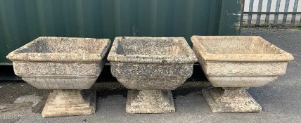 THREE COMPOSITION PLANTERS, square section with moulded rose border, on square based plinths, 52w