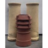 THREE TERRACOTTA CHIMNEY POTS, two measuring 76cms tall, the other 55cms (3)