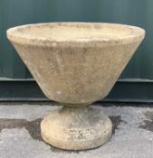 CONICAL COMPOSITION PLANTER on round plinth, 61cms diameter Comments: crack to bowl