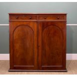 19TH CENTURY MAHOGANY CABINET, fitted two drawers above arch panelled doors enclosing sliding