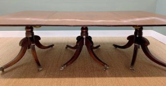 REGENCY TRIPLE-PEDESTAL MAHOGANY DINING TABLE, double reeded top above ringed columns, with brass