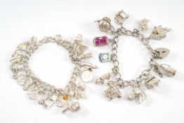THREE SILVER CHARM BRACELETS, well filled with 11, 23 and 10 charms respectively, together with a