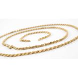 TWO 9KT GOLD SPIRAL LINK CHAINS, 34.4gms gross, in Herbert Brown & Youngs box Provenance: deceased