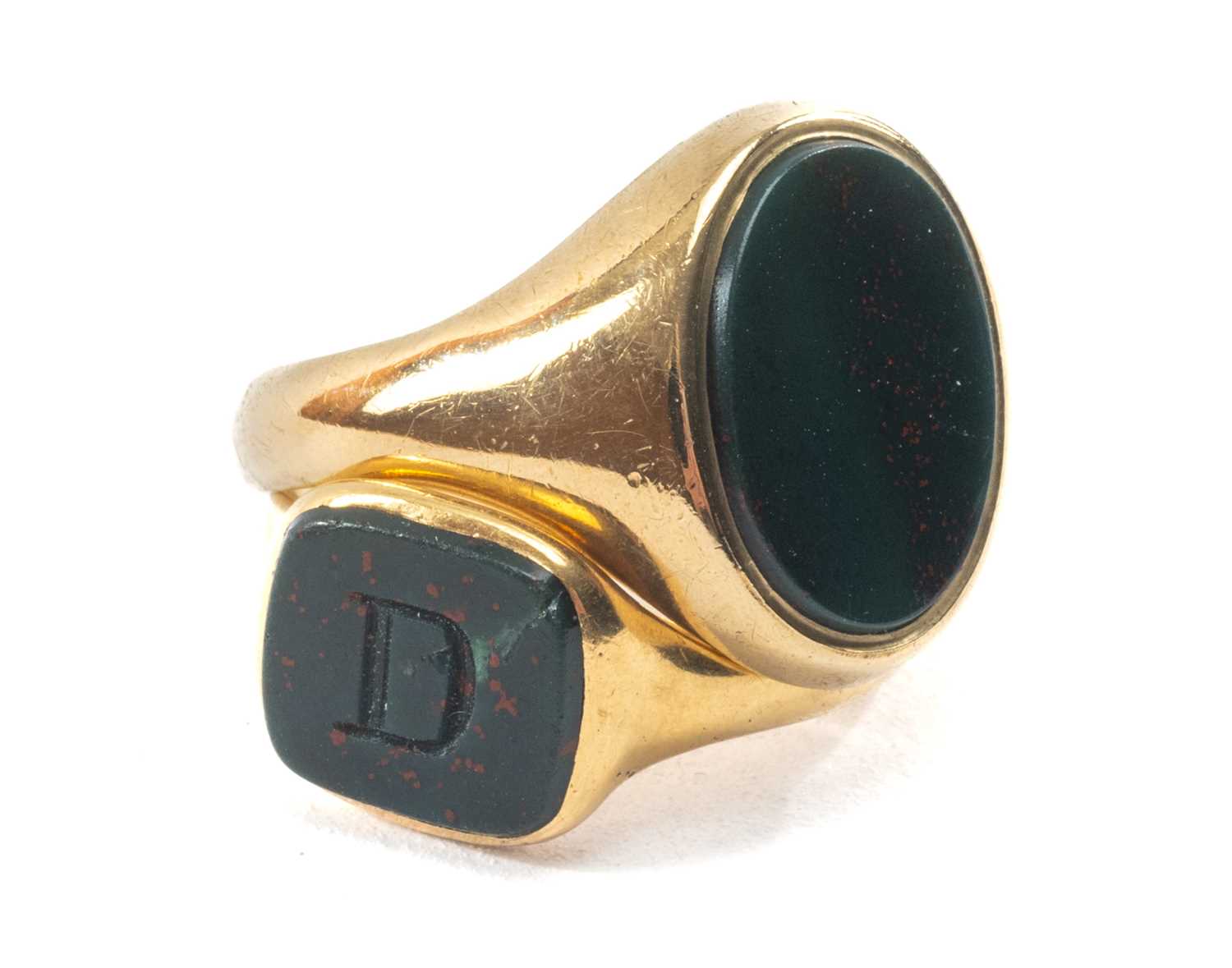 TWO GOLD BLOODSTONE SIGNET RINGS, comprising 18ct ring carved with initial 'D', 5.4g; and 9ct