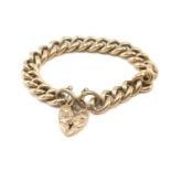 9CT GOLD CHUNKY CURB LINK BRACELET, engraved flower head heart shaped padlock, 63.6gms Provenance: