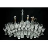 ASSORTED CUT GLASSWARE, including two silver-mounted decanters, a moulded glass claret jug, and