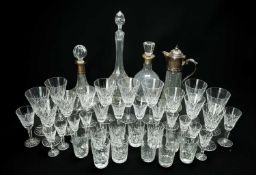 ASSORTED CUT GLASSWARE, including two silver-mounted decanters, a moulded glass claret jug, and