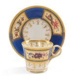 CHAMBERLAIN WORCESTER COFFEE CUP & SAUCER, c. 1815, of Baden shape, enamelled with summer flower