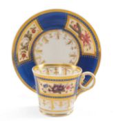 CHAMBERLAIN WORCESTER COFFEE CUP & SAUCER, c. 1815, of Baden shape, enamelled with summer flower