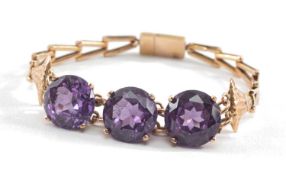 12CT EGYPTIAN GOLD BRACELET, set with three large brilliant cut believed colour change corundum,