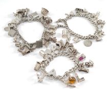 THREE SILVER CHARM BRACELETS, filled with 16, 14 & 24 charms each, tot appr wt. 6.9ozt (3)