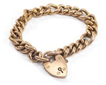 9CT GOLD CURB LINK BRACELET, heart shaped padlock, 25.1gms, in Davies Jewellers of Lampeter box