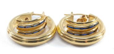 TWO PAIRS OF 18CT GOLD EARRINGS, one of hoop design, the other curved pair set with sapphires,