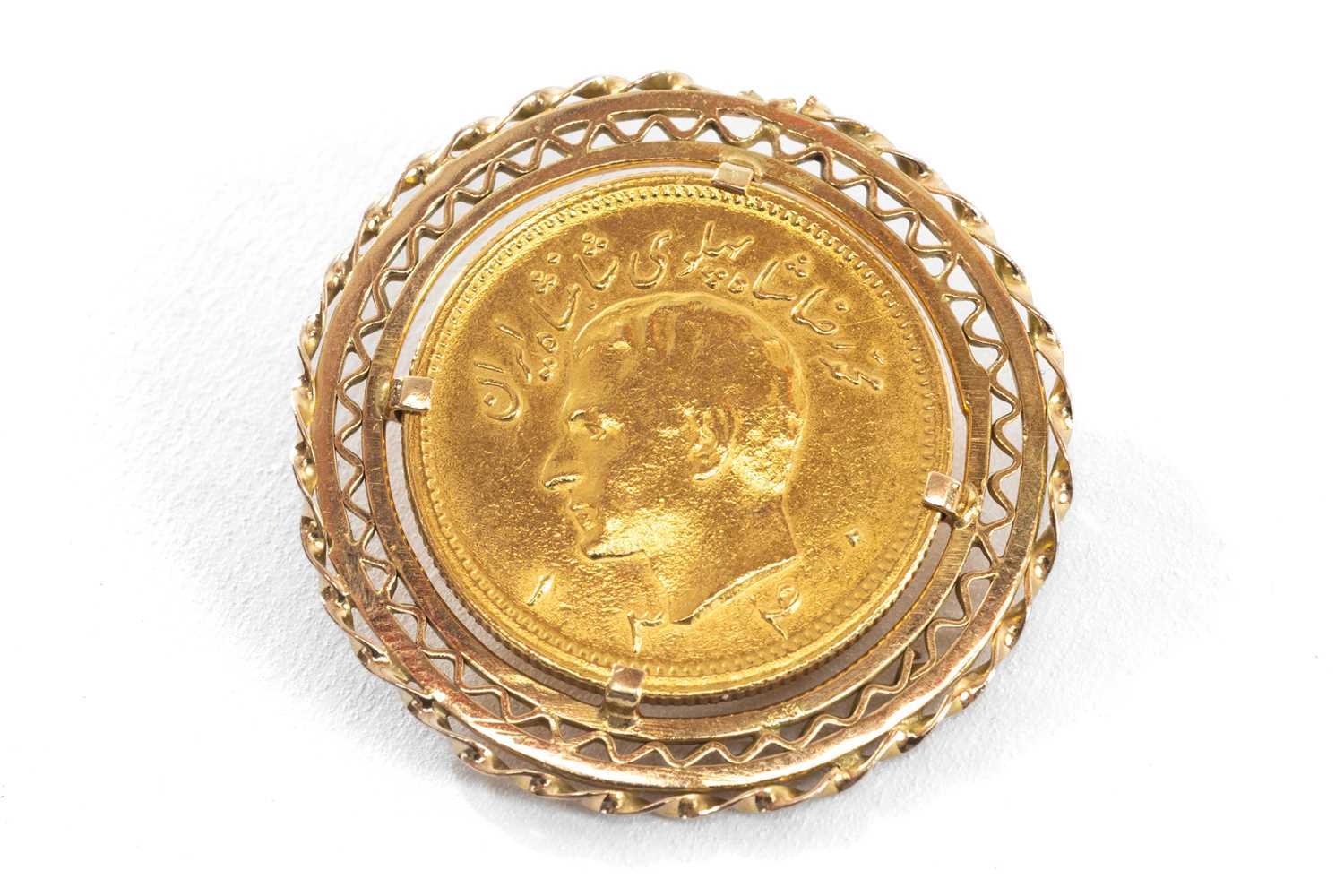 ONE PAHLAVI GOLD COIN, featuring the bust of Mohammed Reza and the emblem of Persia with a Lion