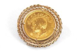 ONE PAHLAVI GOLD COIN, featuring the bust of Mohammed Reza and the emblem of Persia with a Lion