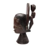 IDOMA HEAD CREST, Nigeria, with flat rear flange supporting rear standing figure, 36cms high