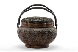 MING CHINESE 'BATS & PEACHES' PATINATED COPPER HAND-WARMER, 17th Century, of six-lobed form, the