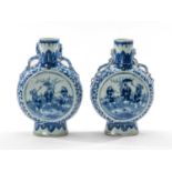 PAIR CHINESE BLUE & WHITE MOON FLASKS, painted with scholars and attendant on a terraced garden,