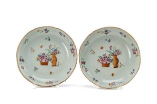 PAIR CHINESE FAMILLE ROSE SAUCER DISHES, Qianlong, of lobed form, centre painted with basket and