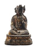CHINESE LACQUERED BRONZE FIGURE OF GUANYIN, late Ming Dynasty, the serene bodhisattva seated in