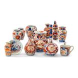 ASSORTED SMALL JAPANESE IMARI JARS, one with cover, together with 2 bottle vases, a teacup and a